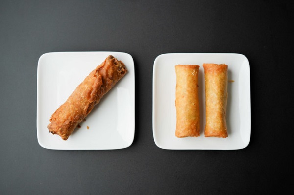 one fried egg roll and two fried spring rolls